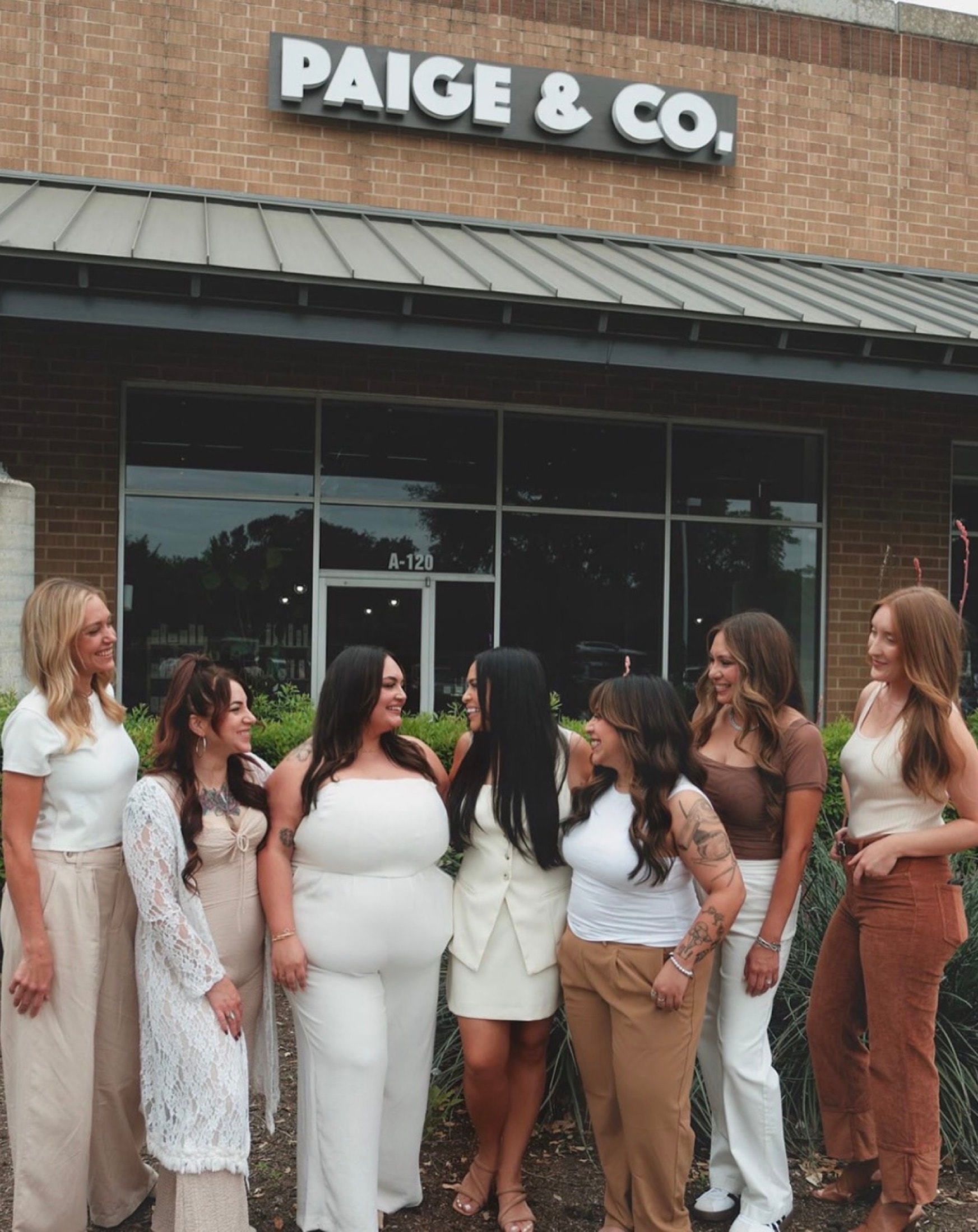 The Paige & Co. Salon team outside the salon on Slaughter Lane